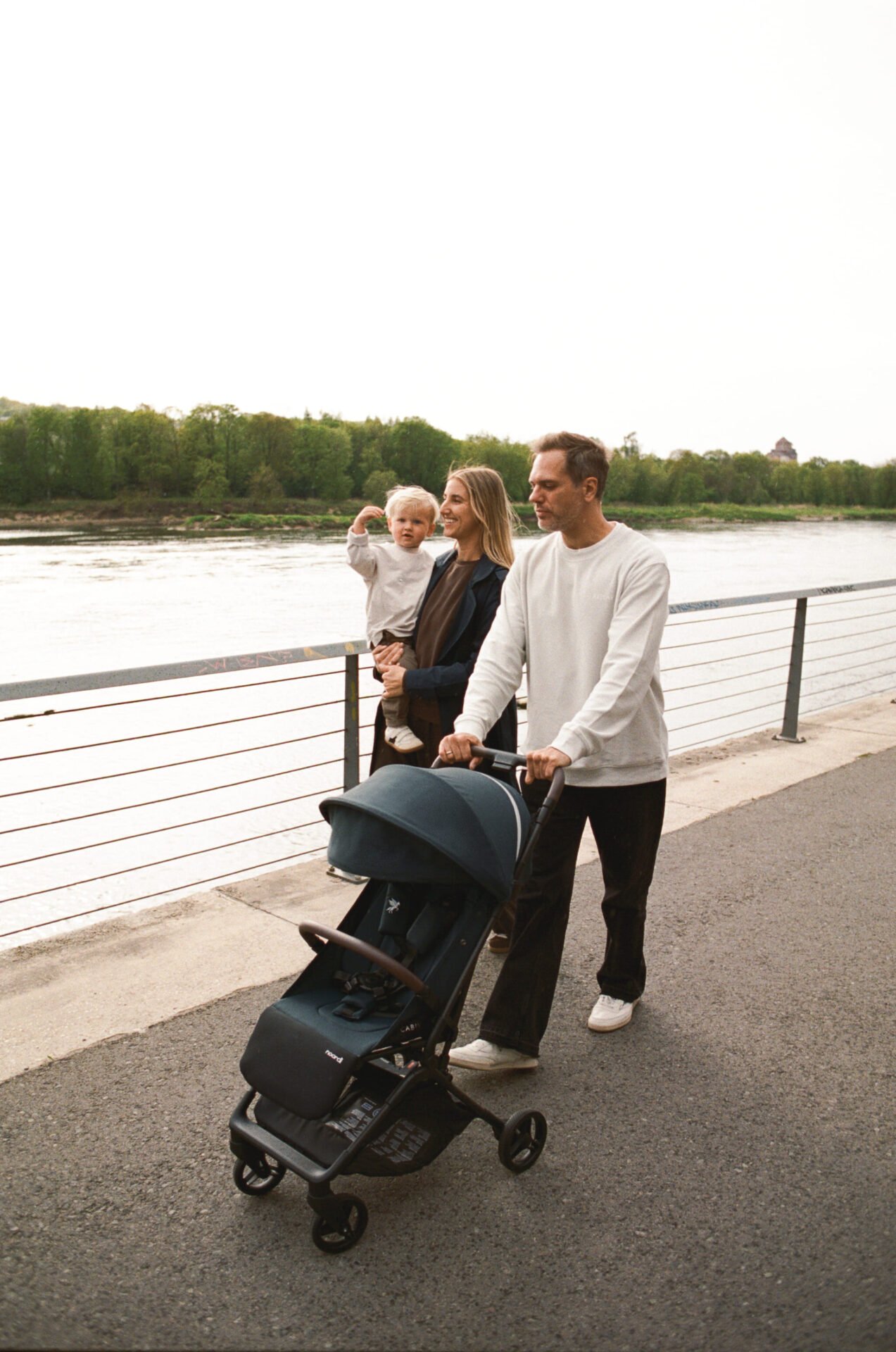 Family with a Noordi pram by a river