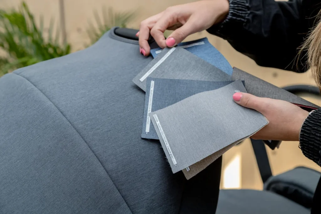 Fabric swatches held against a Noordi pram hood