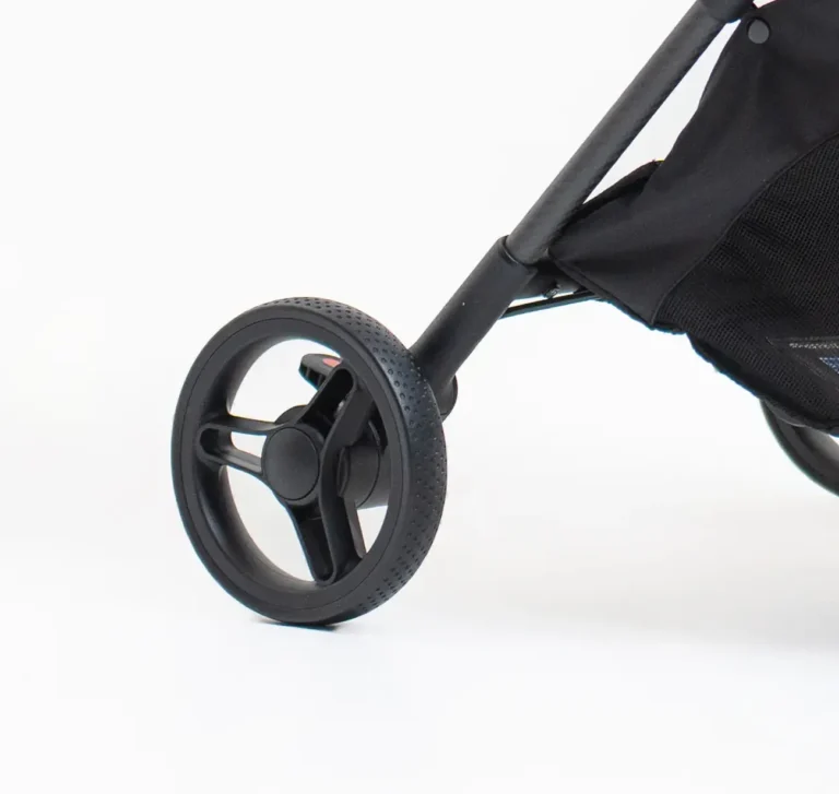 Parking brake pedal with a red tab on the rear wheel